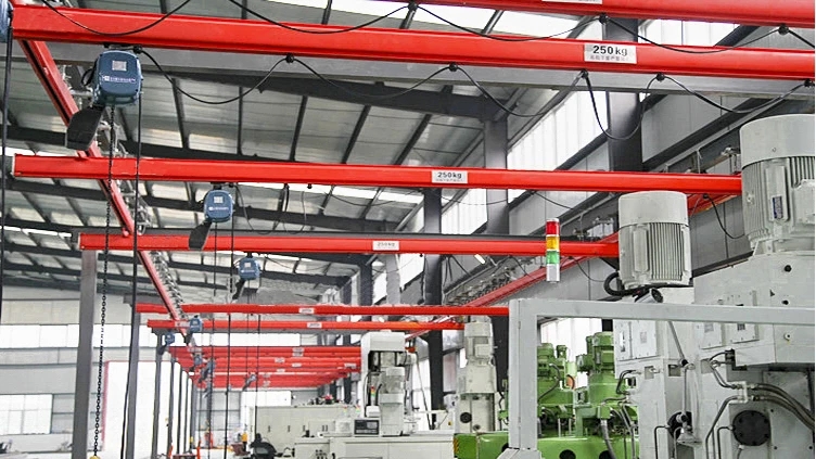 A factory with a KBK Light Crane System and a large machine